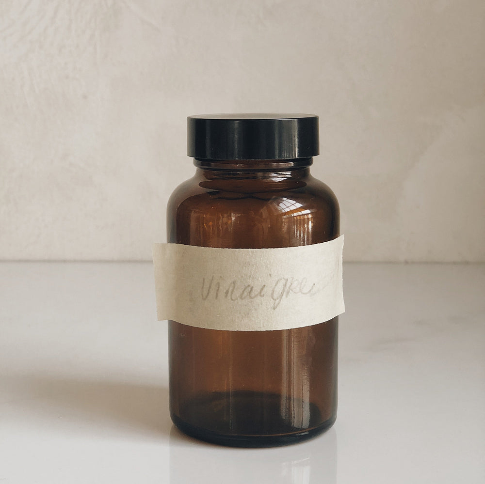 Petite bouteille ambrée vintage