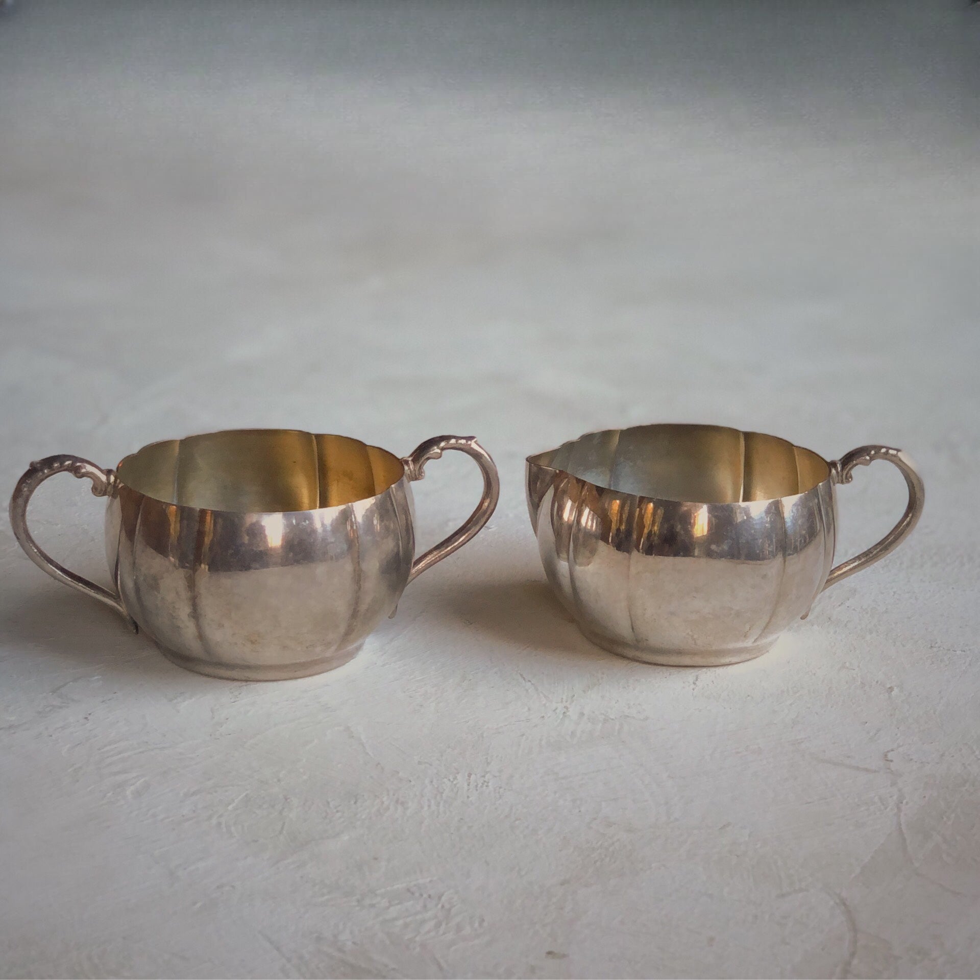 Vintage silver pitcher and sugar bowl.